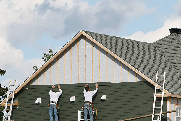 Professional Siding Installation technician working in Thompson, OH
